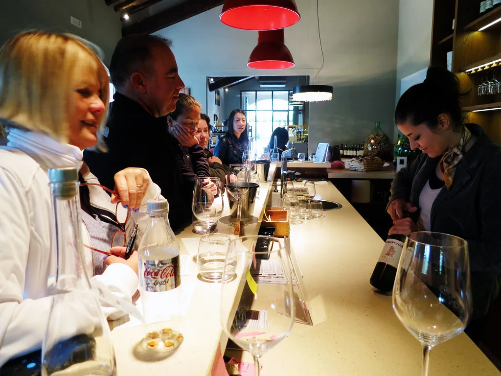 Visitors at the tasting bar at Avignonesi