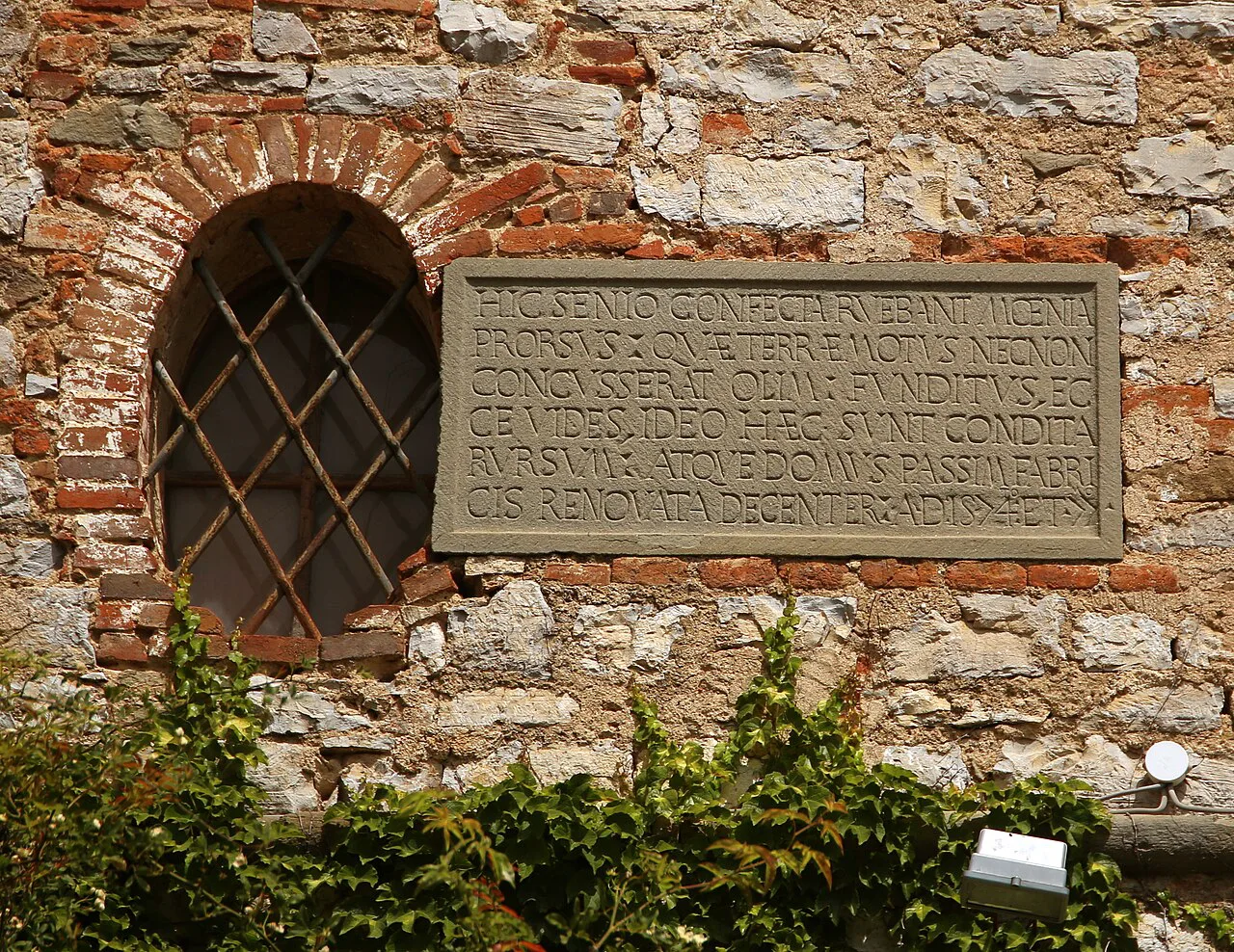 Inner façade of Badia a Coltibuono with its 1574 plaque