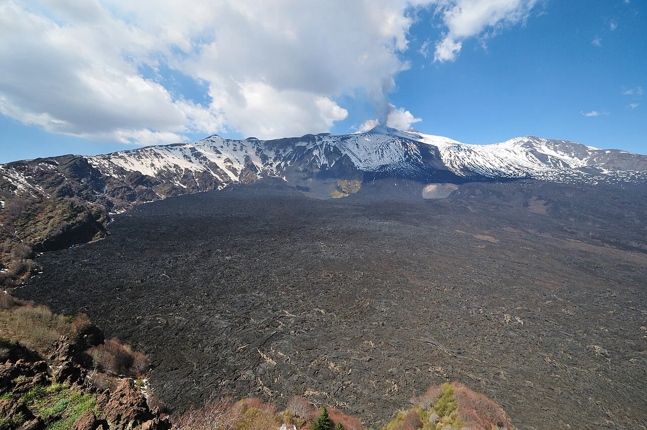 Snow on Mount Etna above old lava flows