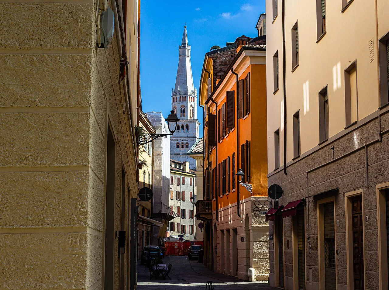 The Ghirlandina tower above a Modena street