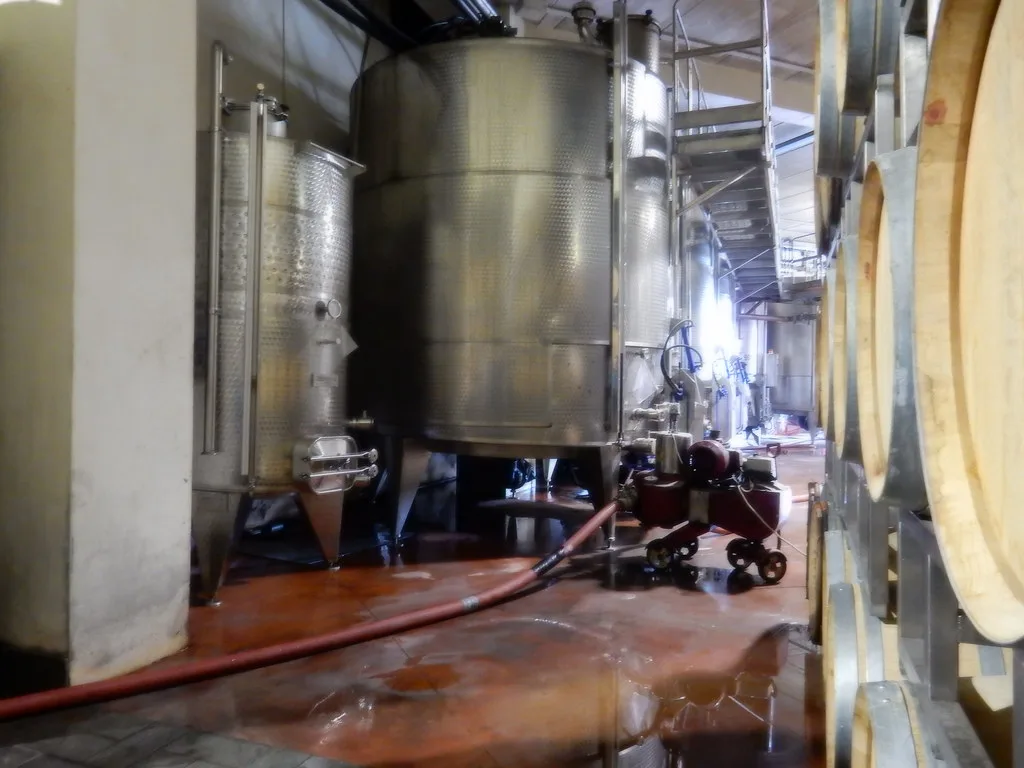 Steel tanks and barrels in the cellar at Patria winery in Solicchiata, on Etna's north slope