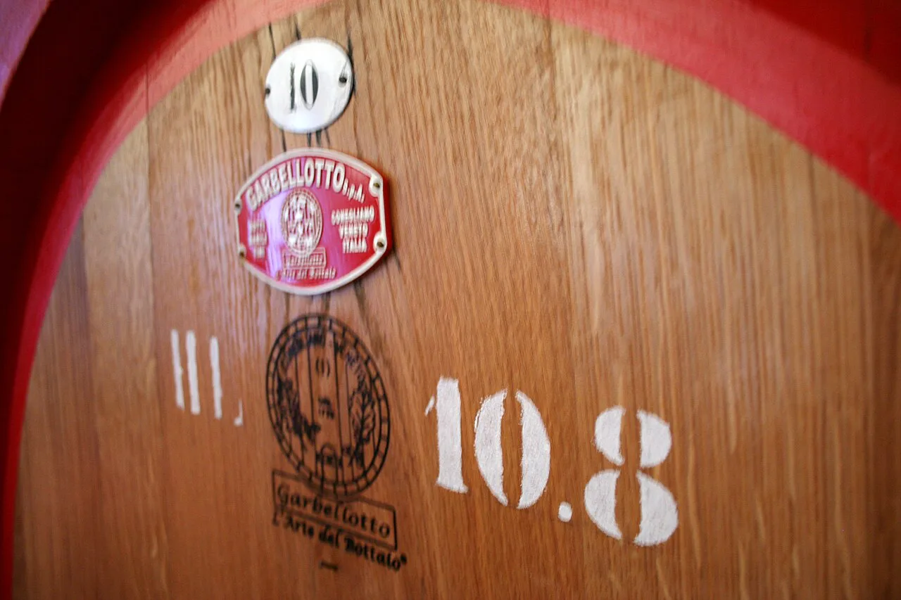 A large oak cask in a Montalcino cellar