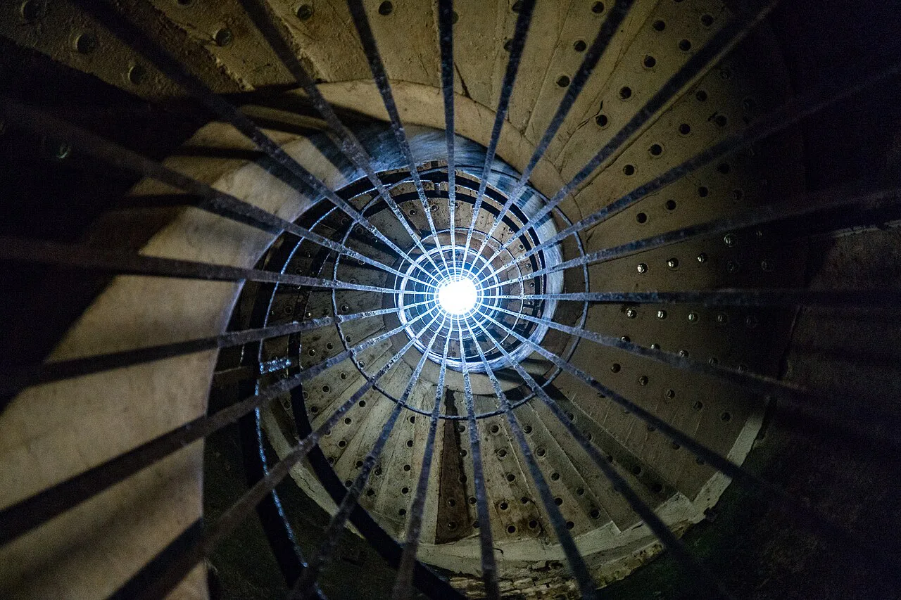 Looking up a staircase in the Taittinger cellars, Reims